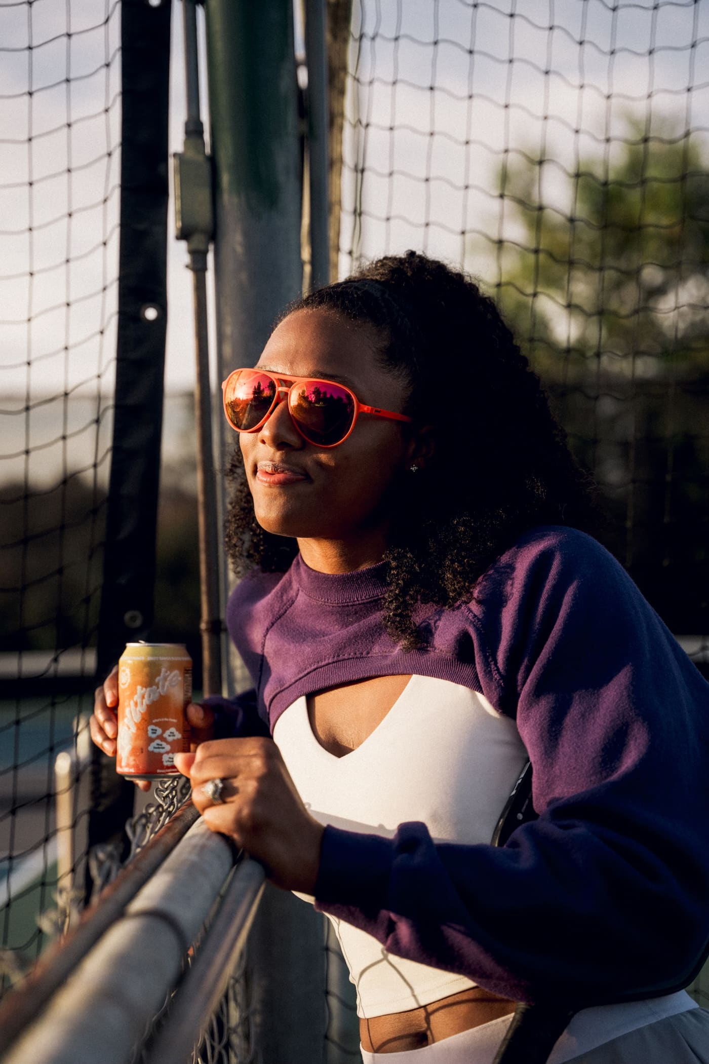 Court-side, orange aviators.